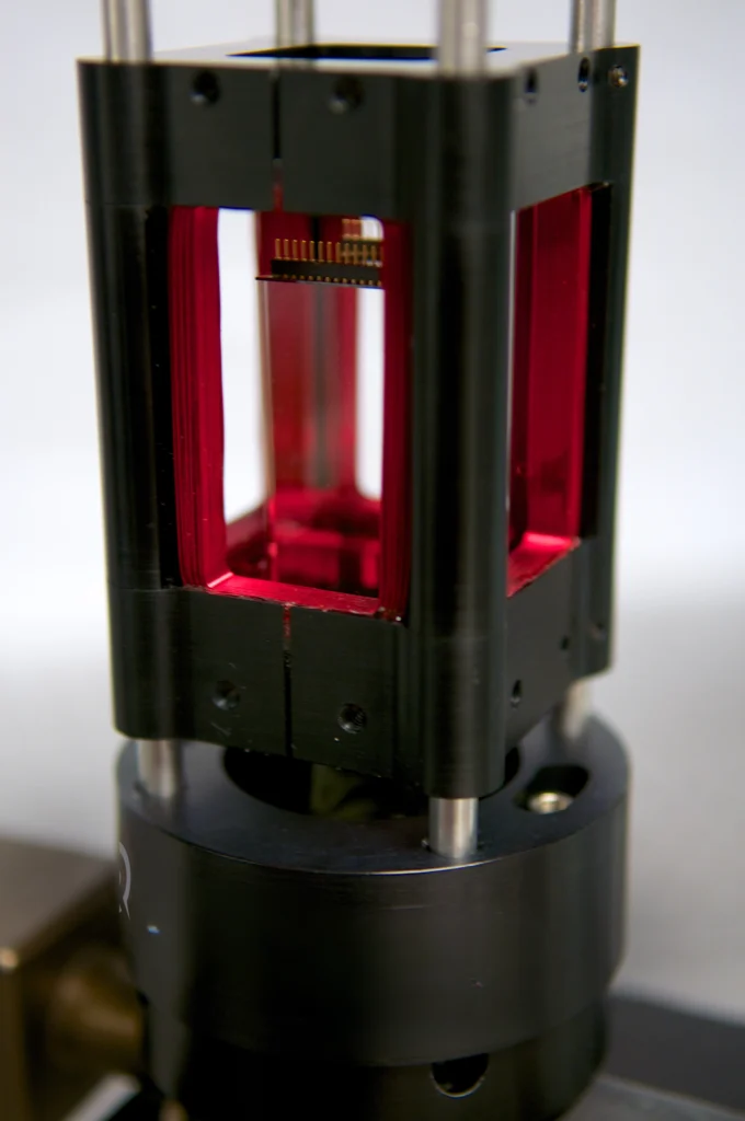 Chip connections are at the top of the cell, by the atom chip