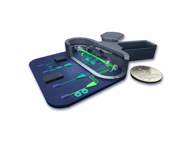 a photonic optimized quantum device sits next to a common coin, showing that pic-enabled devices are very small
